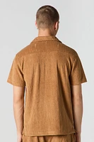 Haut boutonné en tissu éponge texturé