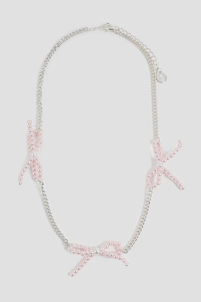 Ardene Pink Pearl Bow Necklace in Silver