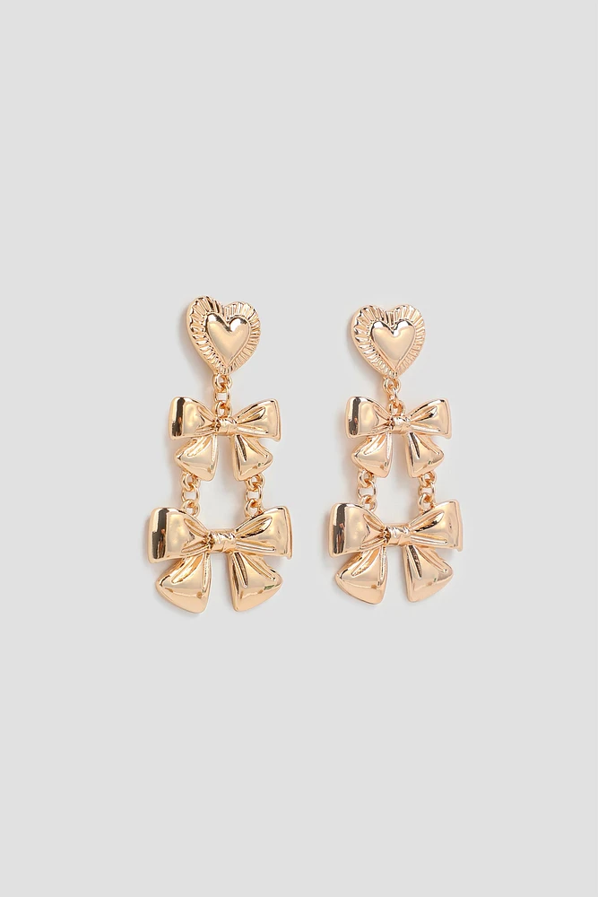 Ardene Double Bow Dangle Earrings in Gold | Stainless Steel