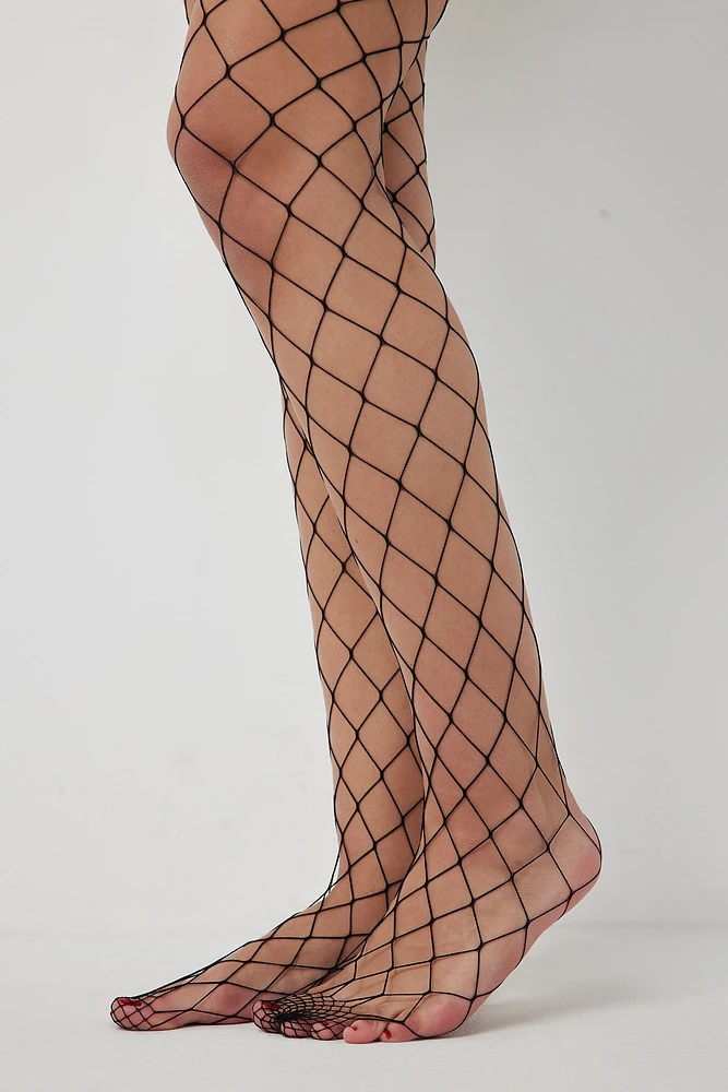 Ardene Hole Fishnet Tights in Black | Nylon/Spandex