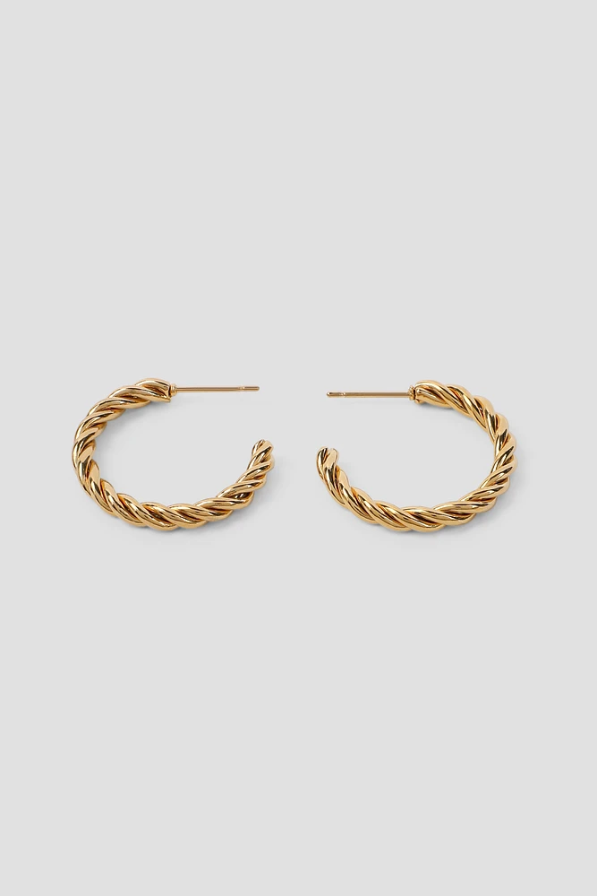 Ardene Stainless Steel Twisted Hoop Earrings in Gold