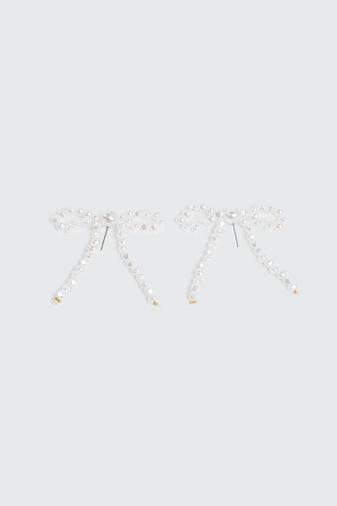 Ardene Pearl Bow Shape Earrings in White | Stainless Steel