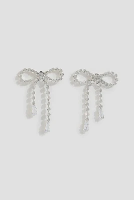 Ardene Rhinestone Bow Earrings in Silver | Stainless Steel