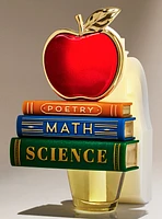 Diffuseur avec contrôle de la fragrance veilleuse pomme sur des livres