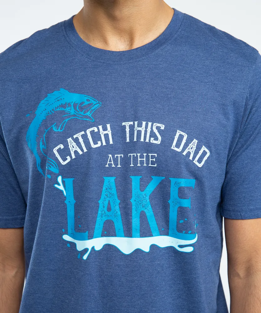 catch this dad at the lake tee