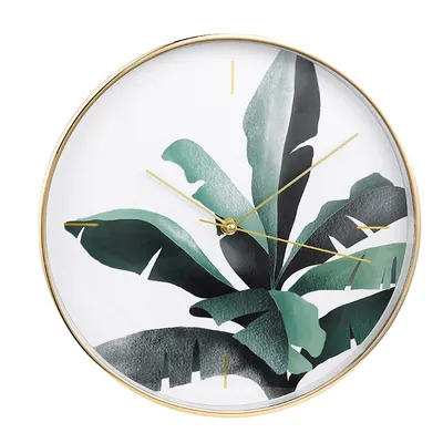 Gold Wall Clock and Banana Leaves