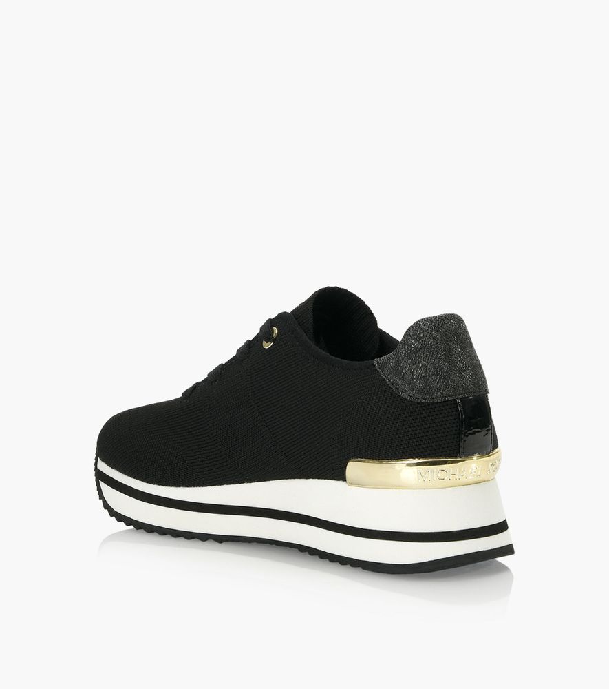 MICHAEL KORS MONIQUE KNIT TRAINER - Black Fabric | BrownsShoes