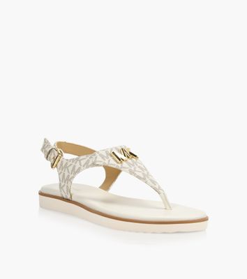 MICHAEL KORS JILLY FLAT SANDAL - Beige Leather | BrownsShoes | Bramalea  City Centre