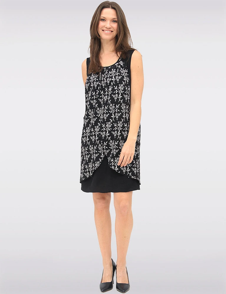 Versatile Black & White Sleeveless Dress with Printed Flowy Overlay by Devia
