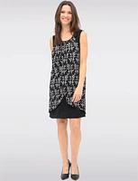 Versatile Black & White Sleeveless Dress with Printed Flowy Overlay by Devia