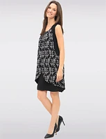 Versatile Black & White Sleeveless Dress with Printed Flowy Overlay by Devia