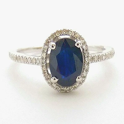 5X7MM Oval Blue Sapphire and Diamond Halo Ring in 14KT White Gold