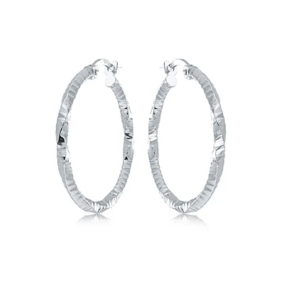 Twisted hoop earrings - 10K white Gold. Color: white | Doucet Latendresse