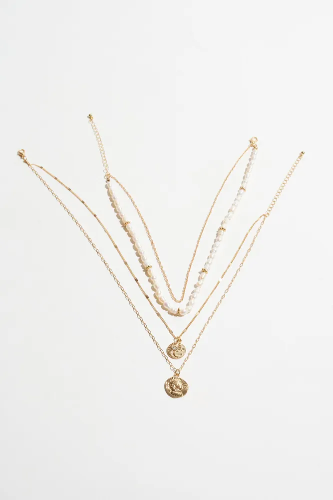 Layered Pearl & Worn Medallion Necklace