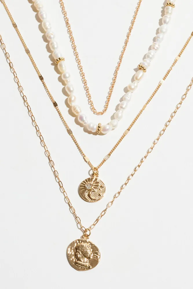 Layered Pearl & Worn Medallion Necklace