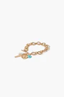 Women's Rhinestone Cross Toggle Bracelet in Gold