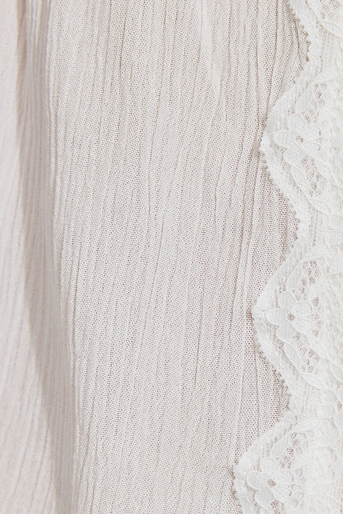 Camisole ouverte avec bordure en dentelle