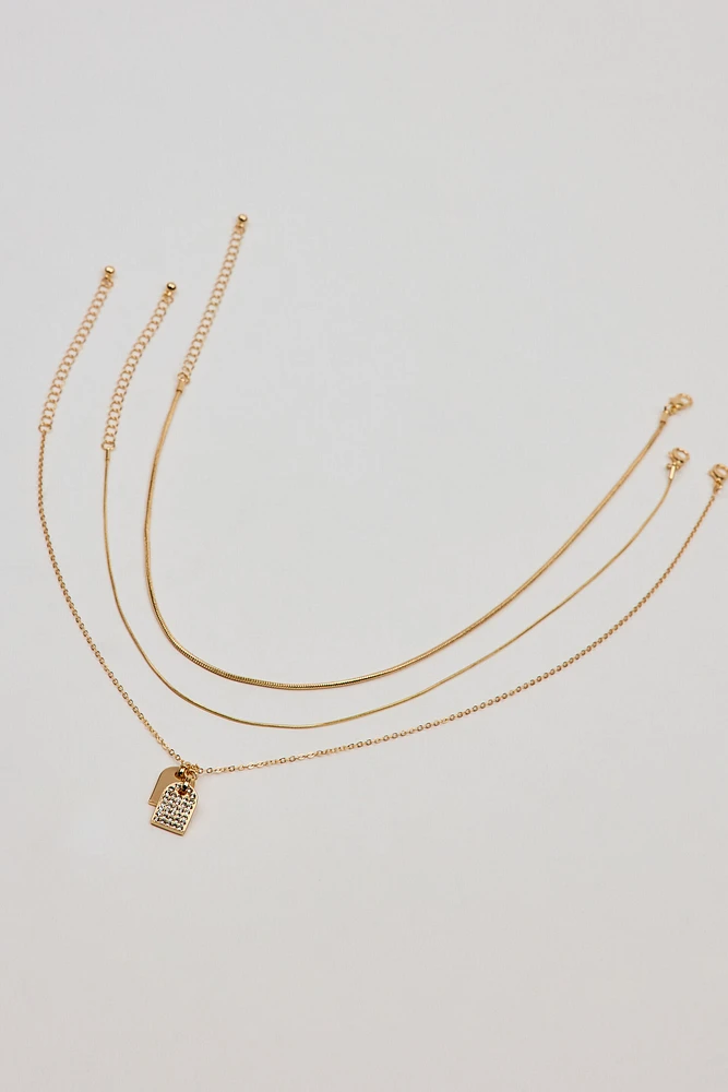 Ensemble de 3 colliers avec plaquettes d’identit