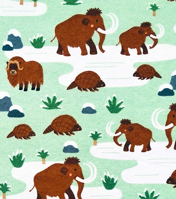 The Stone Age on Green Super Snuggle Flannel Fabric