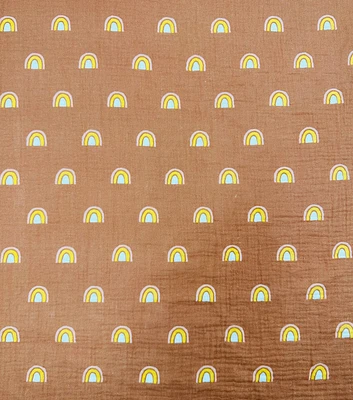 Rainbows on Dark Orange Bubble Gauze Fabric by POP!