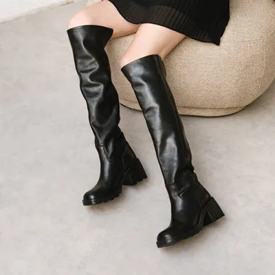 Heeled boots with notched soles
