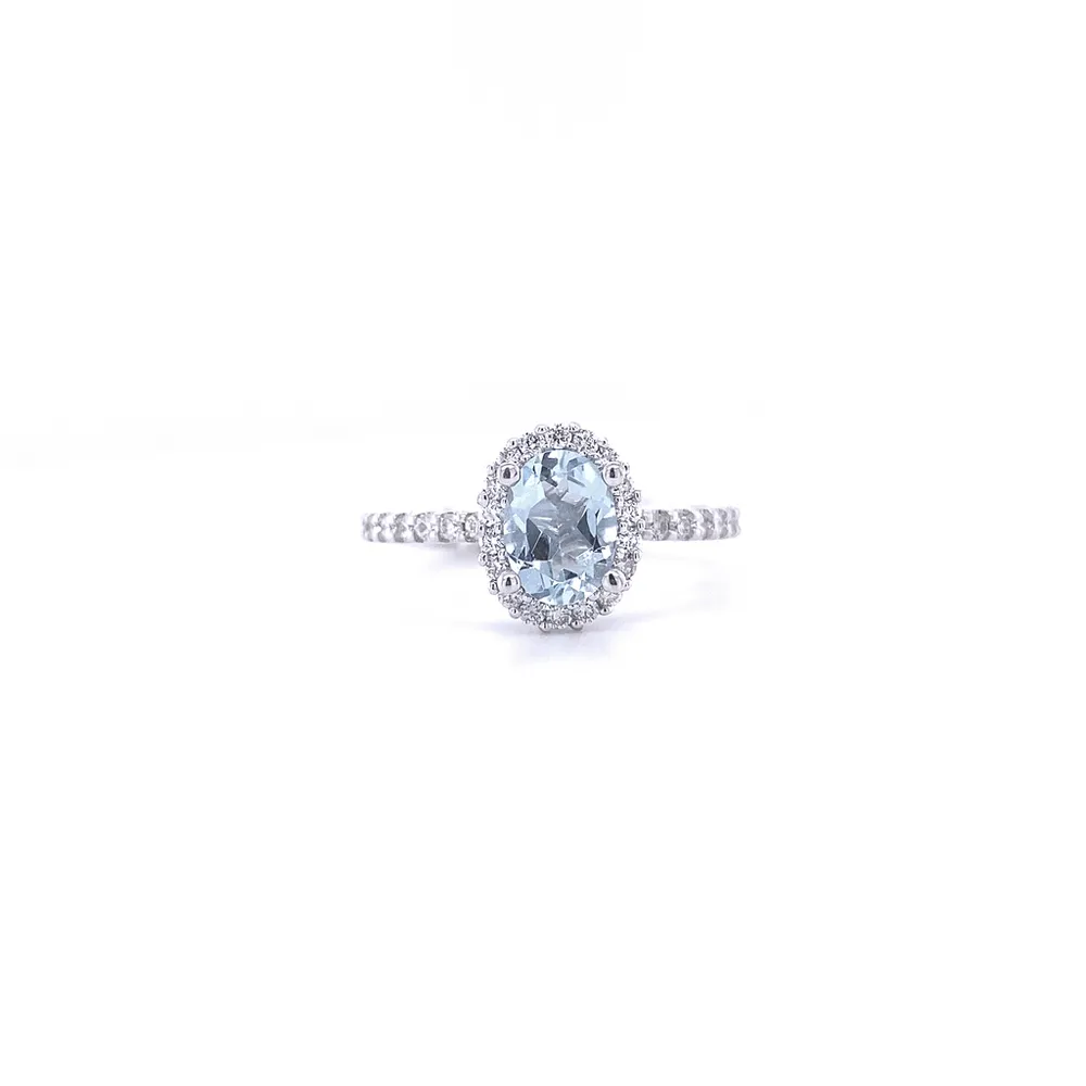 14 Karat White Gold Blue Topaz and Diamond Halo Ring