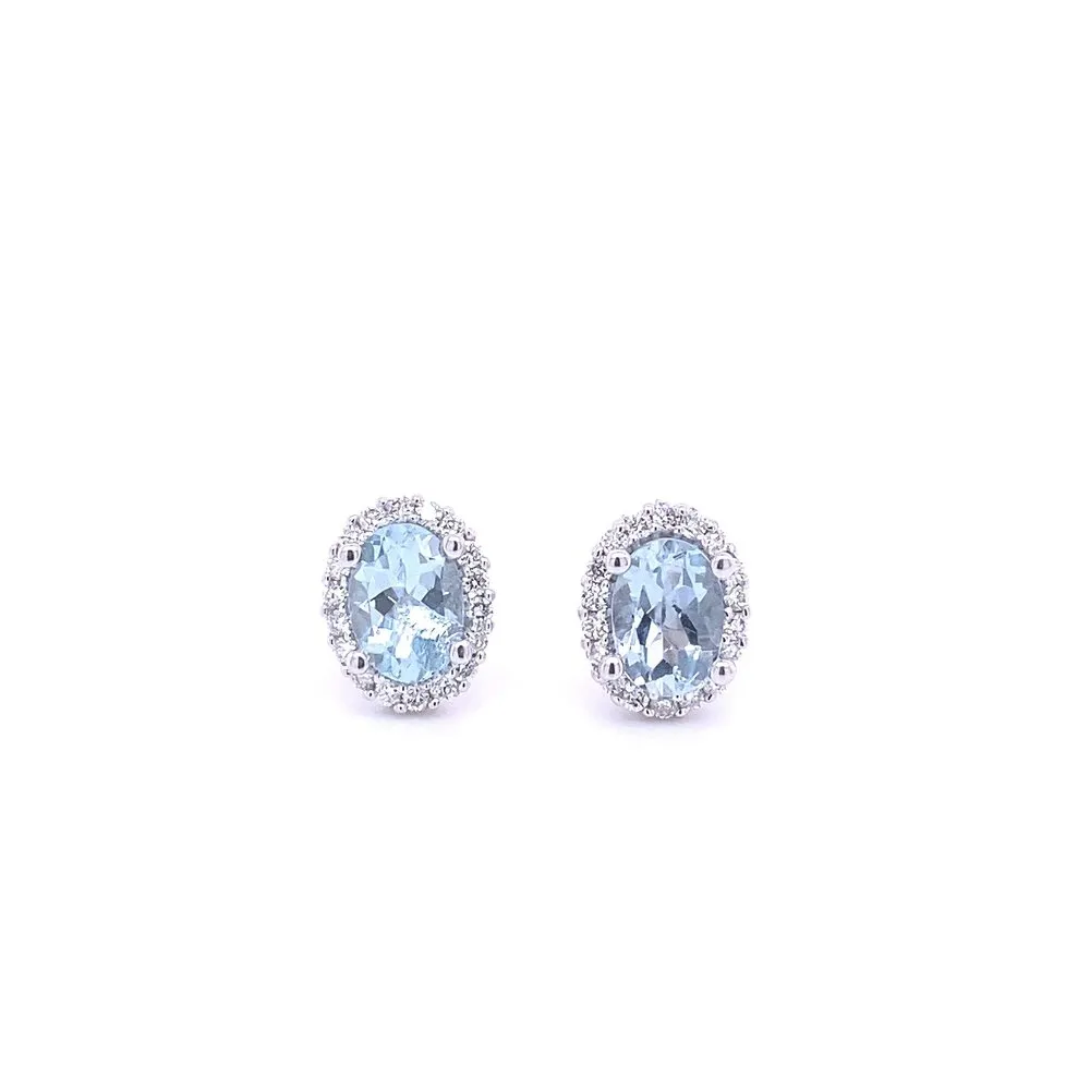 14 Karat White Gold Blue Topaz and Diamond Halo Oval Stud Earrings