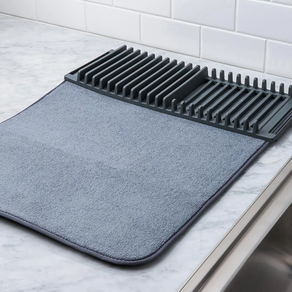 https://cdn.mall.adeptmind.ai/https%3A%2F%2Fwww.kitchenstuffplus.com%2Fmedia%2Fcatalog%2Fproduct%2F8%2F6%2F86823_Umbra_Udry_Drying_Mat_with_Rack__Charcoal_1.jpg%3Fwidth%3D1000%26height%3D%26canvas%3D1000%2C%26optimize%3Dhigh%26fit%3Dbounds_large.webp