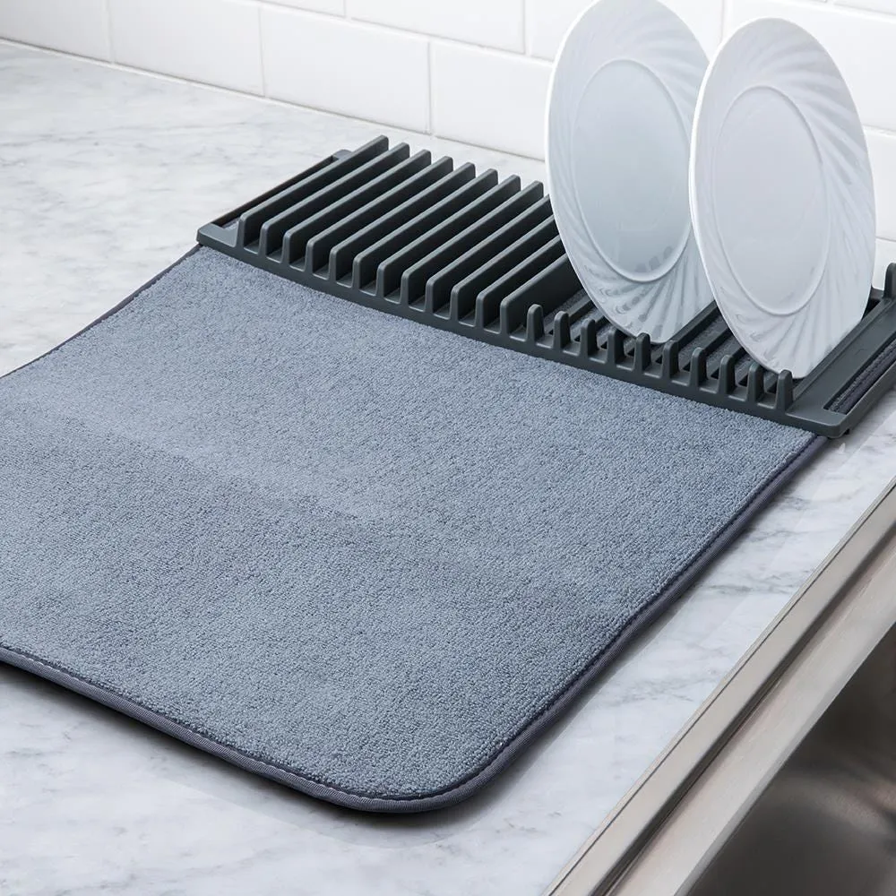 https://cdn.mall.adeptmind.ai/https%3A%2F%2Fwww.kitchenstuffplus.com%2Fmedia%2Fcatalog%2Fproduct%2F8%2F6%2F86823_Umbra_Udry_Drying_Mat_with_Rack__Charcoal_2.jpg%3Fwidth%3D1000%26height%3D%26canvas%3D1000%2C%26optimize%3Dhigh%26fit%3Dbounds_large.webp