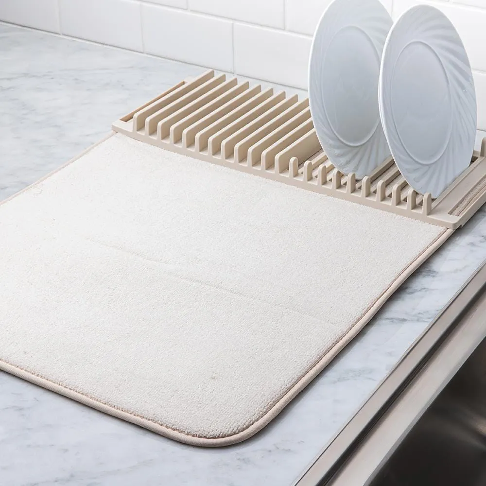 https://cdn.mall.adeptmind.ai/https%3A%2F%2Fwww.kitchenstuffplus.com%2Fmedia%2Fcatalog%2Fproduct%2F8%2F6%2F86824_Umbra_Udry_Drying_Mat_with_Rack__Linen_2.jpg%3Fwidth%3D1000%26height%3D%26canvas%3D1000%2C%26optimize%3Dhigh%26fit%3Dbounds_large.webp