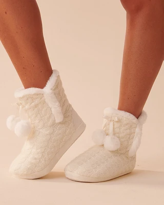 Pantoufles bottines effet tricoté à pompons