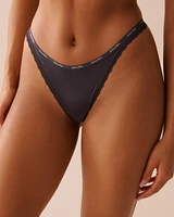 Culotte tanga microfibre et bordure de dentelle