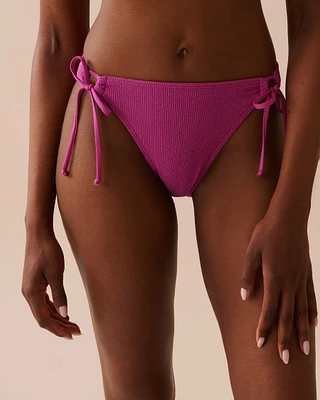 Bas de bikini brésilien noué aux hanches texturé MAGENTA