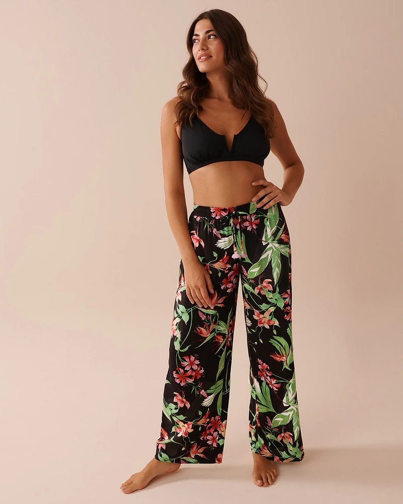 Pantalon jambe large à imprimé tropical