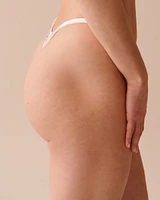 Culotte string ajustable en dentelle et résille