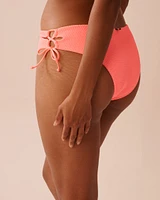 CORAL CRUSH Textured Side Tie Cheeky Bikini Bottom