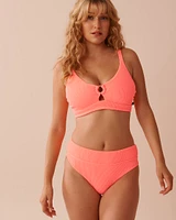 CORAL CRUSH Textured Mid Waist Brazilian Bikini Bottom