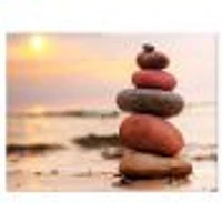 Stones Pyramid on Sand Symbolizing Zen  Wall Art