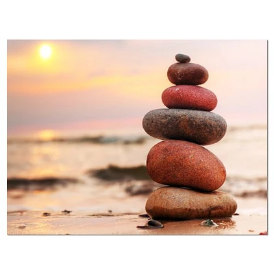 Toile « Stones Pyramid on Sand Symbolizing Zen »