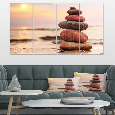 Stones Pyramid on Sand Symbolizing Zen Canvas Wall Art panels