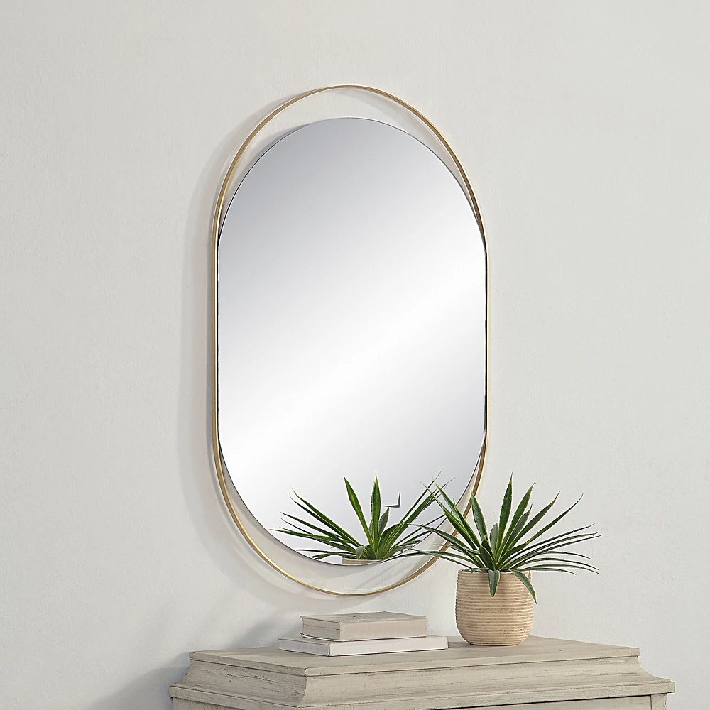 Miroir ovale Ecru en laiton satiné