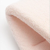 Exfoliant texturé pour le bain et la douche