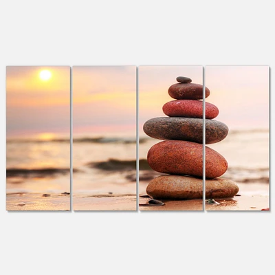 Stones Pyramid on Sand Symbolizing Zen Canvas Wall Art panels