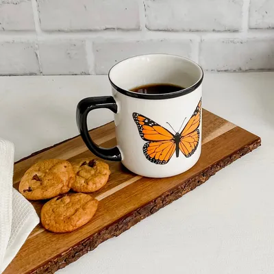 Butterfly black-rimmed mug