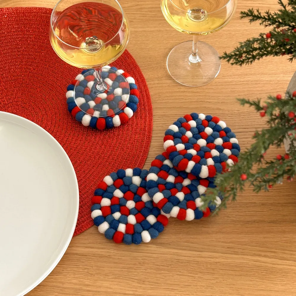 Wool felt ball coasters by torre & tagus - red blue white