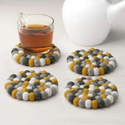 Wool felt ball coasters by torre & tagus - yellow white grey