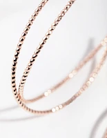 Rose Gold Crossover Hoop Earrings