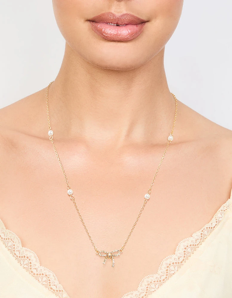 Gold Plated Station Pearl Diamante Bow Pendant Necklace