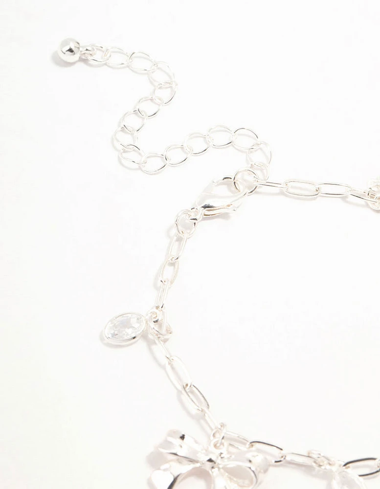 Silver Plated Alternating Cubic Zirconia & Bow Charm Bracelet
