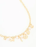 Gold Plated Cross & Mixed Charm Necklace